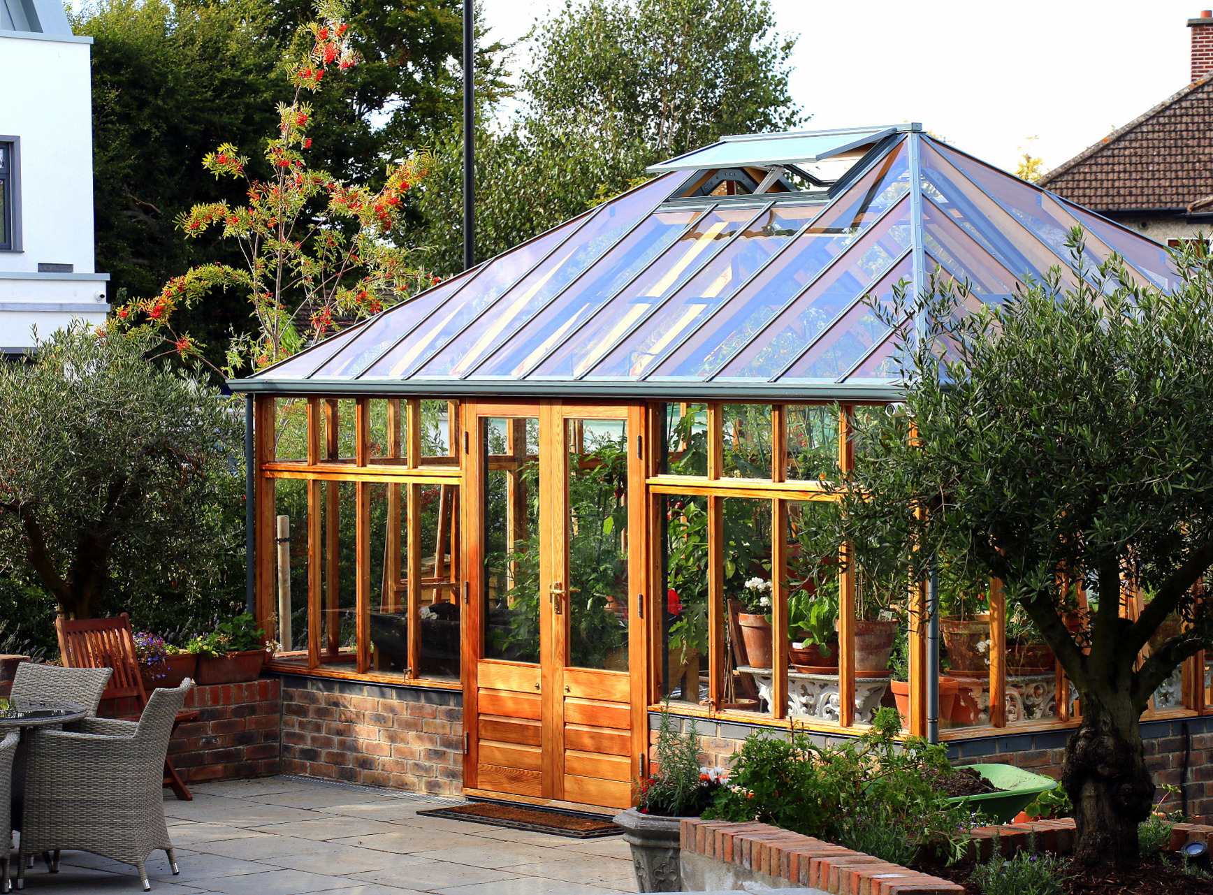Patio design & construction to complement large Glasshouse in Rathfarnham garden | Owen Chubb Garden Landscapers