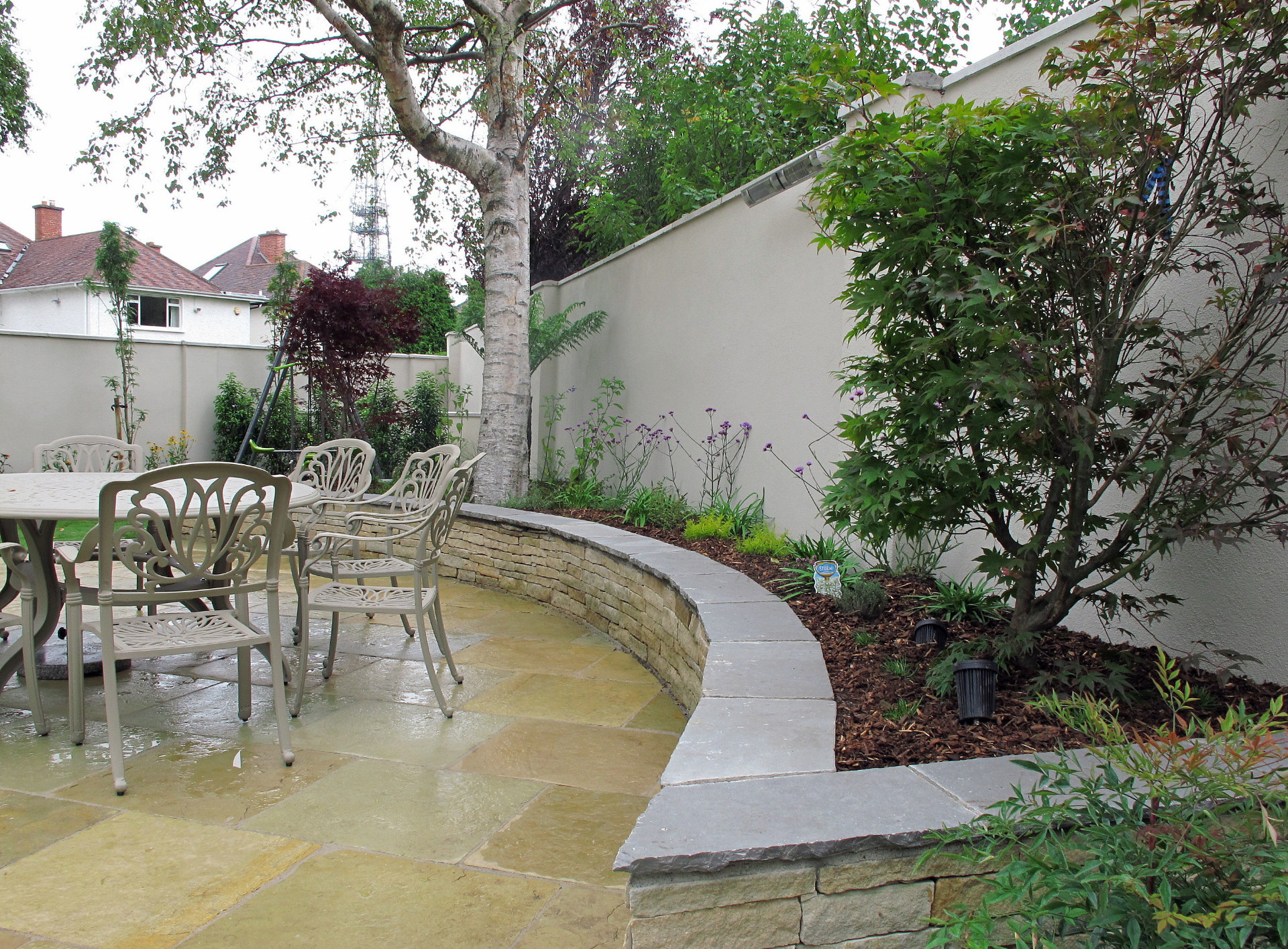 Yellow Limestone Patio + Raised Planting Bed in Family Garden, Donnybrook, Dublin 4 | Owen Chubb Garden Landscapers