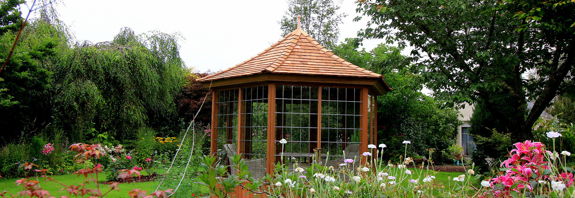 A stunning 3.0m six sided Garden Summerhouse from Victorian Garden Buildings - supplied + fitted by Owen Chubb Garden Landscapers