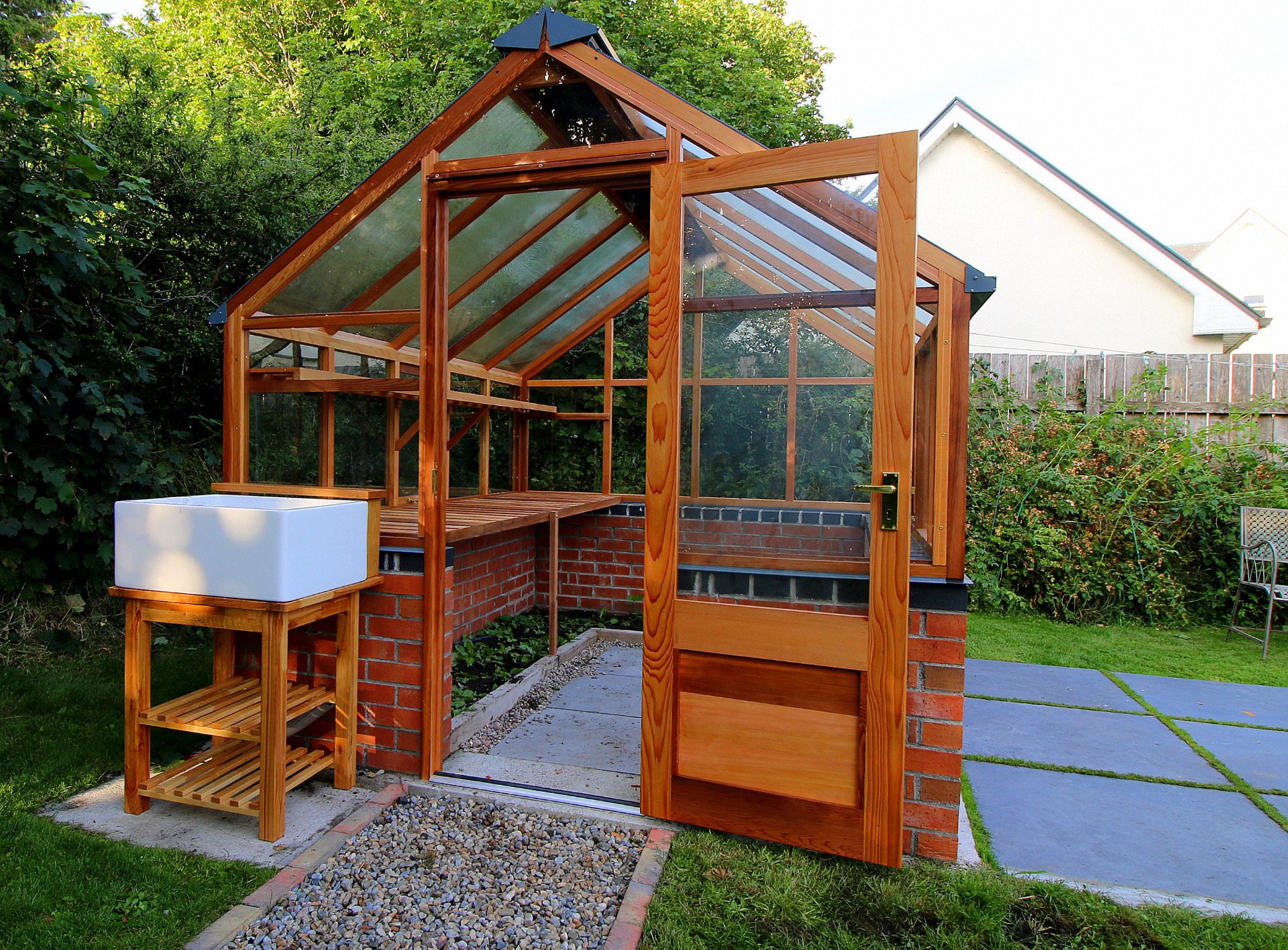 Classic Eight Greenhouse on brick wall with optional Osmo UV Wood protection & Belfast Sink on stand