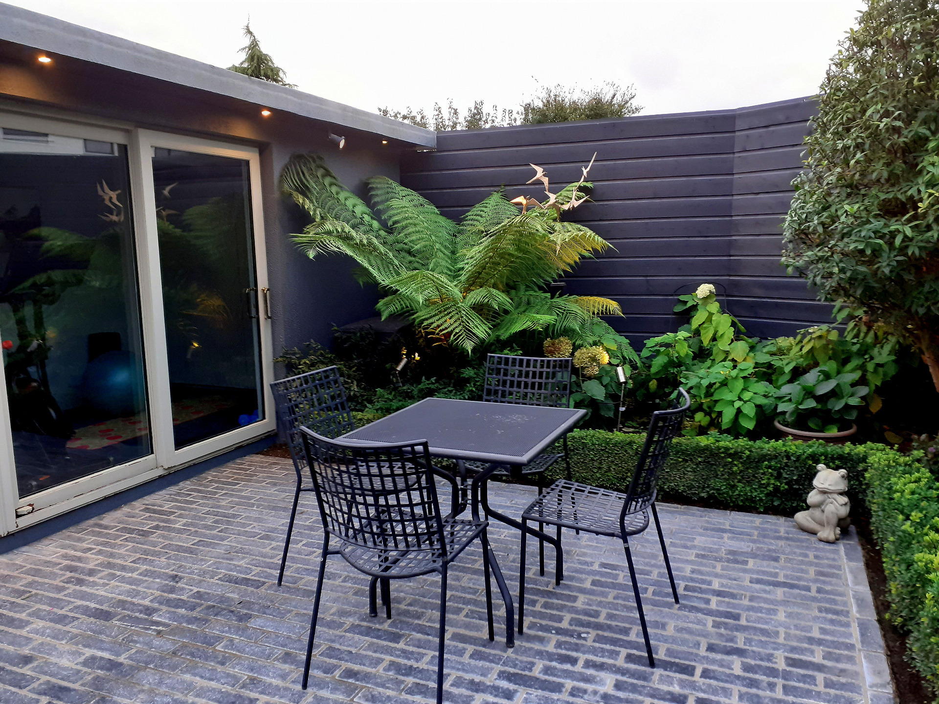 Garden Design & Landscaping in Terenure including custom made Garden Fencing, Biohort Steel Planters, Blue Limestone paving, Biohort Garden Shed,  Artificial Grass - durable finishes, low maintenance, trouble free performance