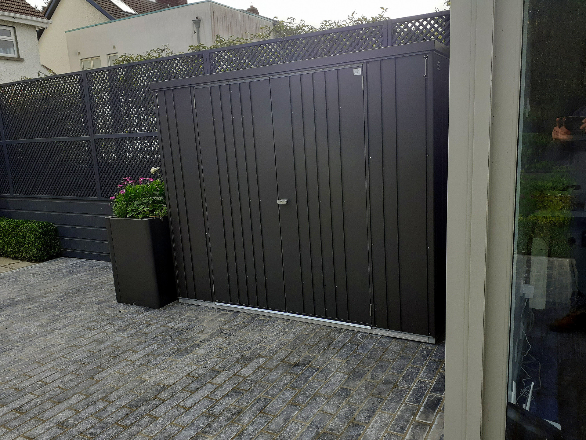 Garden Design & Landscaping in Terenure including custom made Garden Fencing, Biohort Steel Planters, Blue Limestone paving, Biohort Garden Shed,  Artificial Grass - durable finishes, low maintenance, trouble free performance