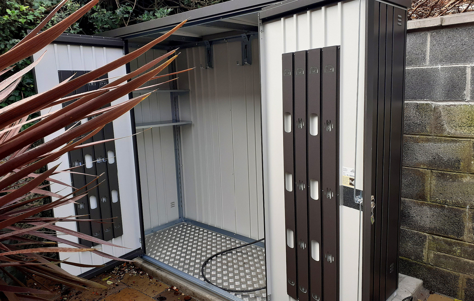 The superb quality and style of the Biohort Equipment Locker 230 in metallic dark grey  with optional accessories including aluminium floor frame, aluminium floor panels | supplied + installed in Ranelagh by Owen Chubb Landscapers. Tel 087-2306 128.
