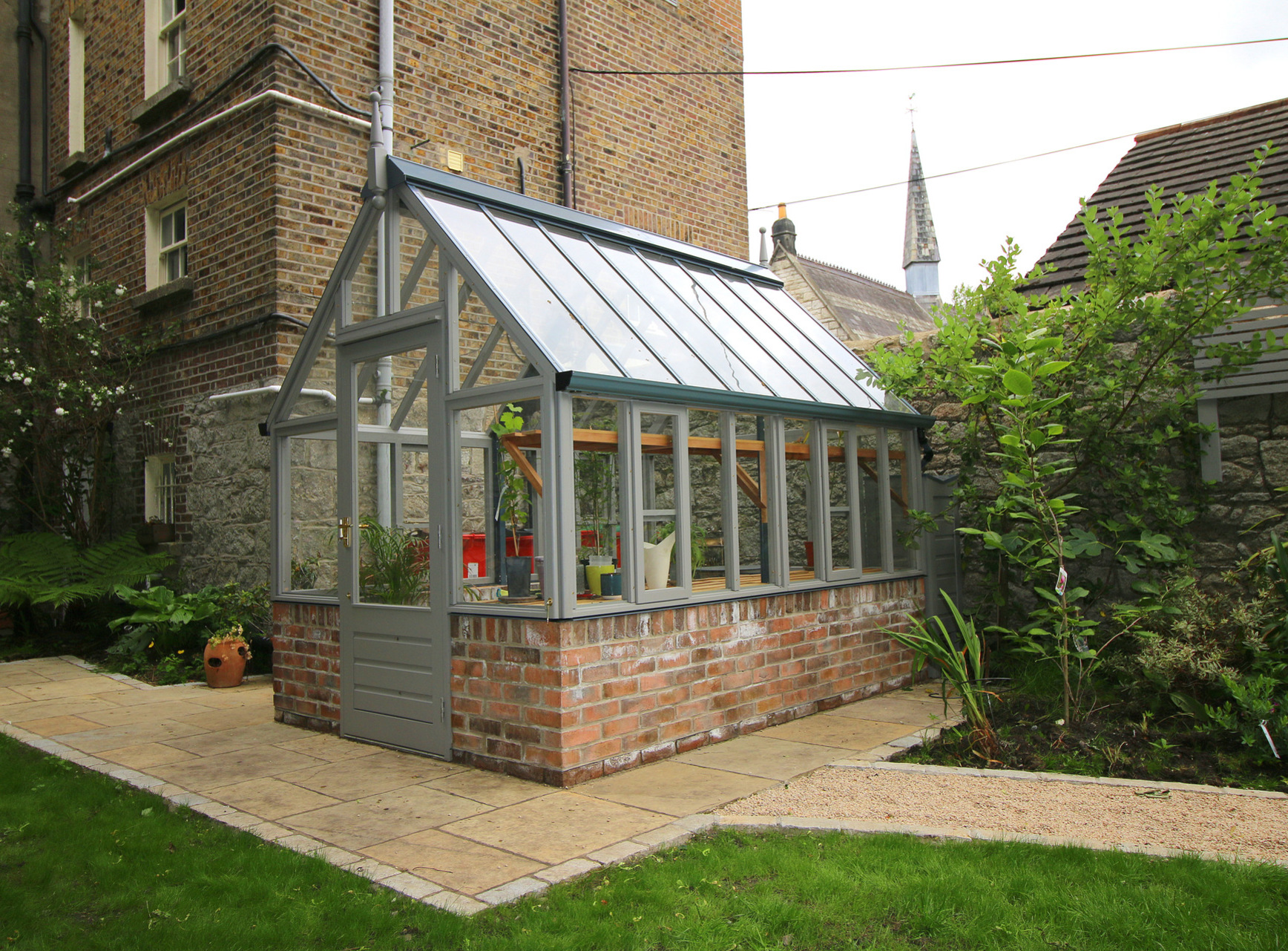 Painted RHS Hyde Hall Greenhouse on dwarf brick wall  | Traditional Victorian timber Greenhouse | Supplied + Fitted in Ranelagh, Dublin 6.