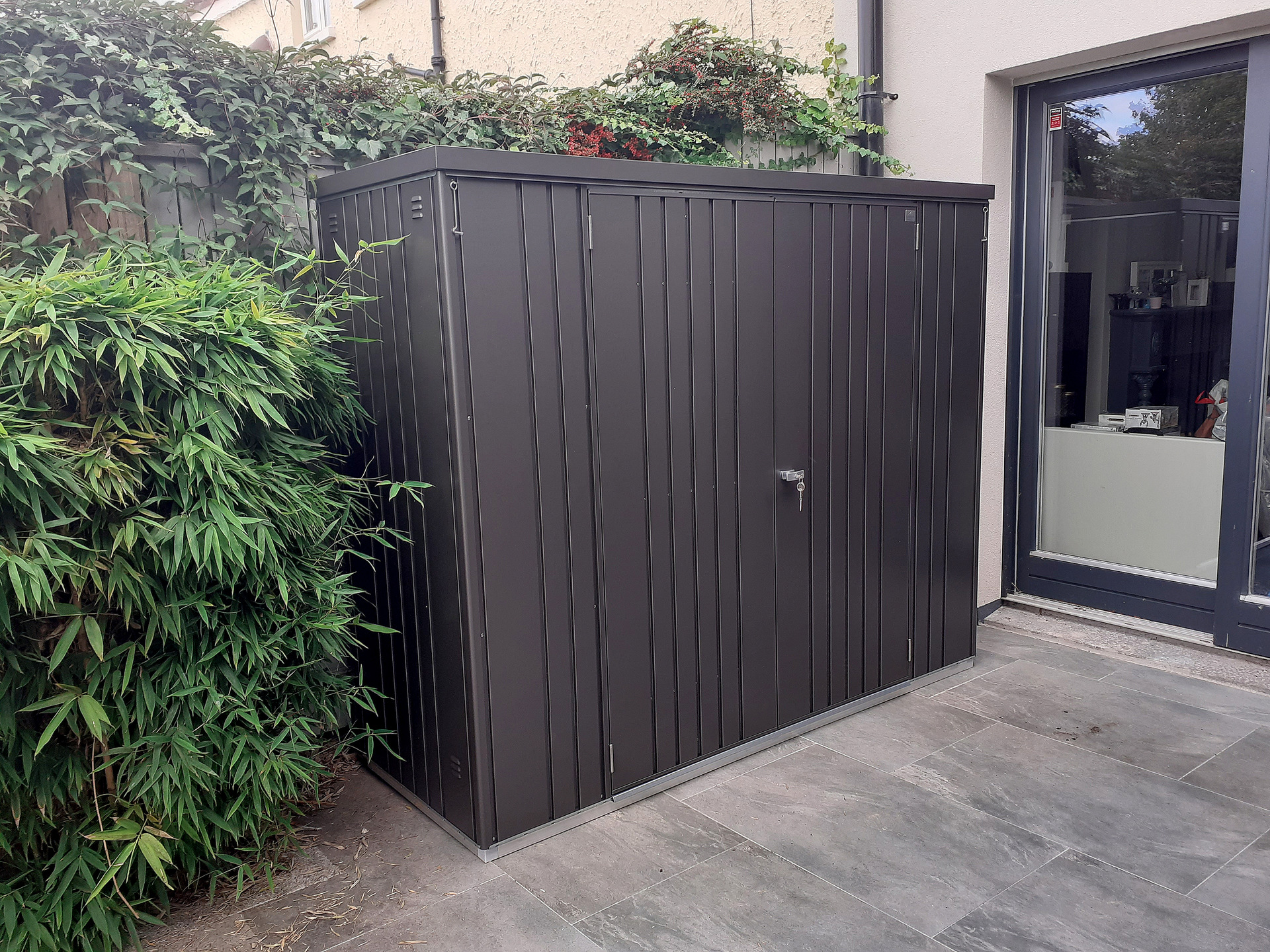 The superb quality and style of the Biohort Equipment Locker 230 in metallic dark grey  with optional accessories including aluminium floor frame, aluminium floor panels | supplied + installed in Terenure, Dublin 6W by Owen Chubb Landscapers. Tel 087-2306 128.
