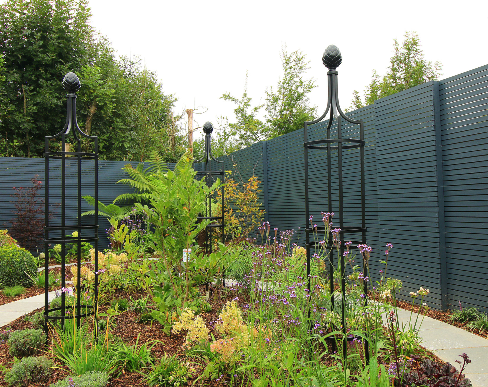 Obelisk I - stylish, robust steel plant supports | Supplied + fitted in Rathcoole, Dublin 24 | The perfect support for climbing roses and adding vertical interest to the planted bed & borders