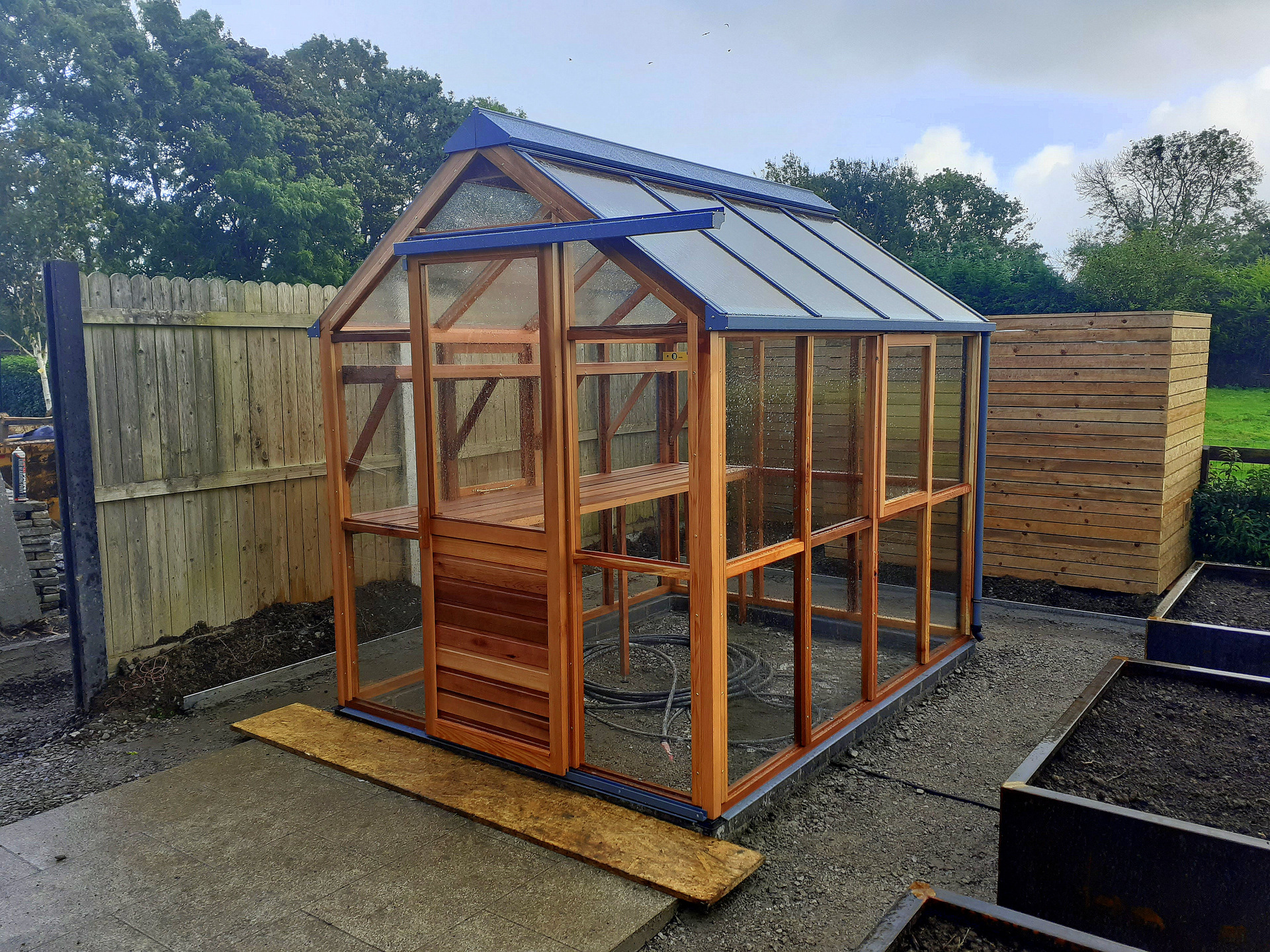 The Gabriel Ash Classic 6 x 8 Greenhouse in Western Red Cedar with optional UV Timber Protection  | Supplied + Fitted in Maynooth, Co Kildare by Owen Chubb Garden Landscapers. Tel 087-2306 128