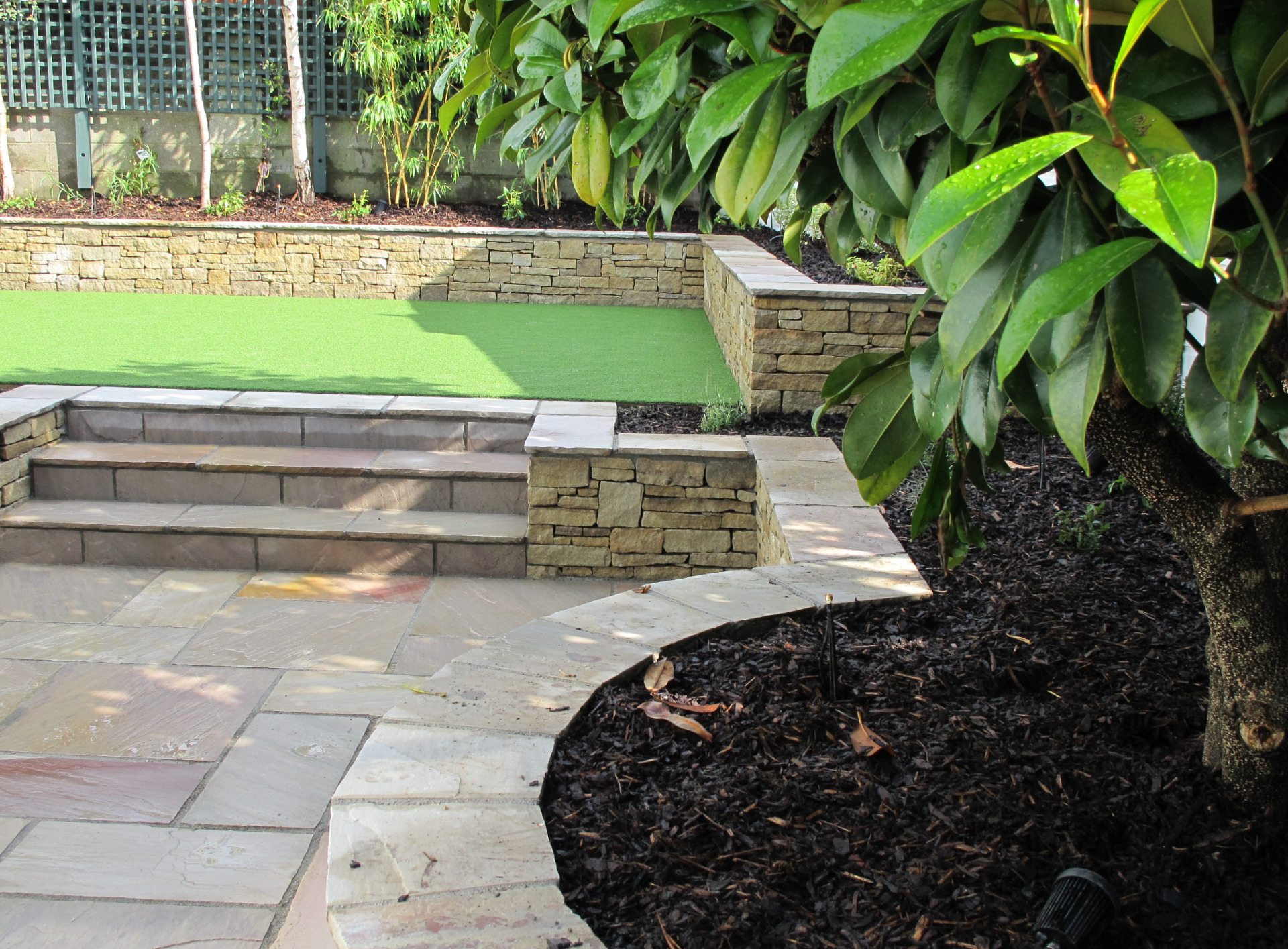Family garden patio and raised lawn in Blackrock garden | Owen Chubb Patio Design & Construction Dublin