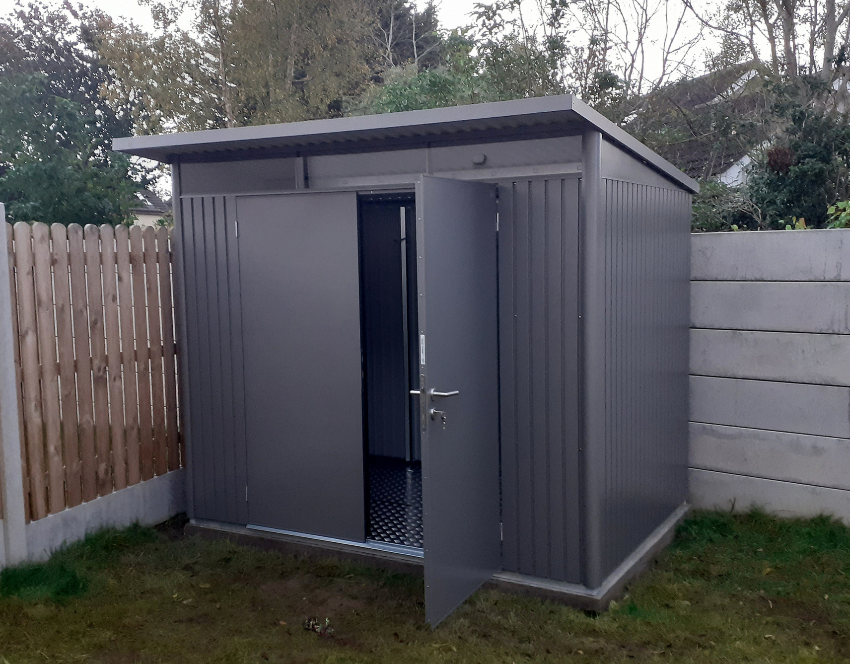 The Biohort AvantGarde A5 Steel Garden Shed in metallic quartz grey with optional accessories including double doors, aluminium floor frame, aluminium floor panels, supplied + fitted in Malahide, Co Dublin | Owen Chubb Garden Landscaper - Ireland's #1 Biohort Dealer, your one-stop shop for Biohort Sheds & Storage. Shop with confidence. Best Prices in Ireland. Fast Delivery & Installation nationwide. Tel 087-2306128.