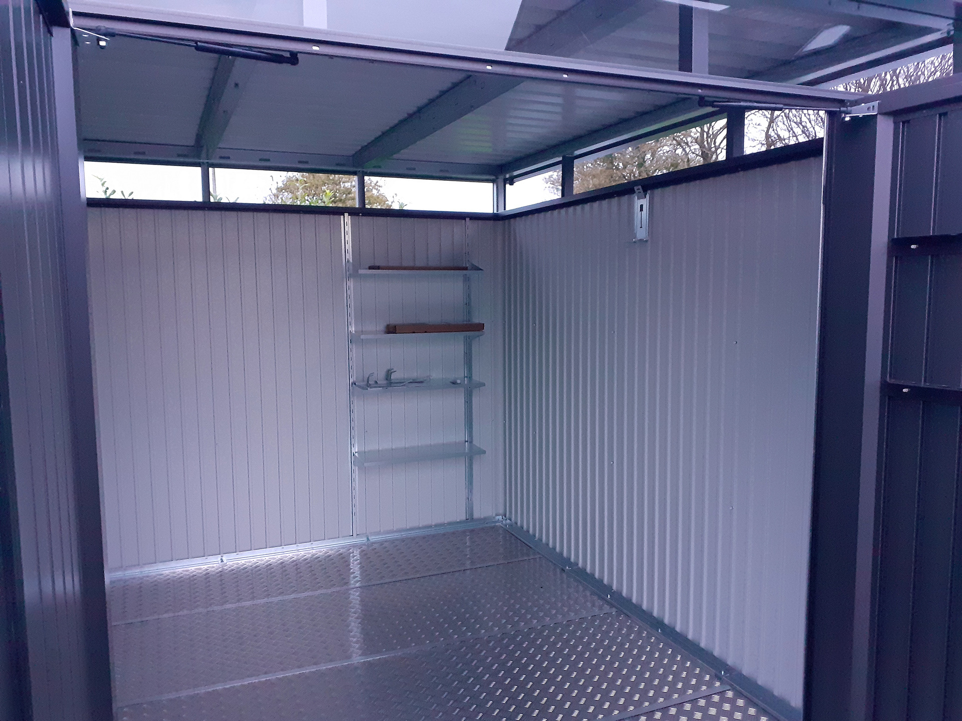 The spacious interior of the Biohort HighLine H5 Garden Shed with optional accessories including aluminium floor frame, aluminium floor panels, Side Canopy - supplied + fitted in Co Kildare | Owen Chubb Garden Landscapers