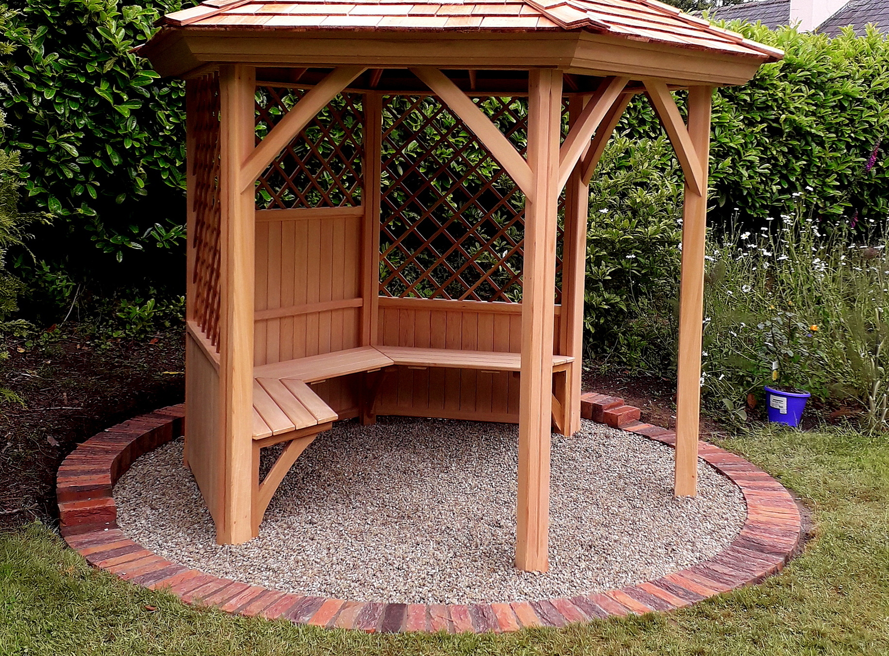 A stunning 2.4m six-sided Garden Gazebo by Victorian Garden Buildings, exceptionally well made in Western Red Cedar, with optional cedar bench. Supplied + Fitted by Owen Chubb Garden Landscapes Limited, in Kilbride, Co Wicklow.