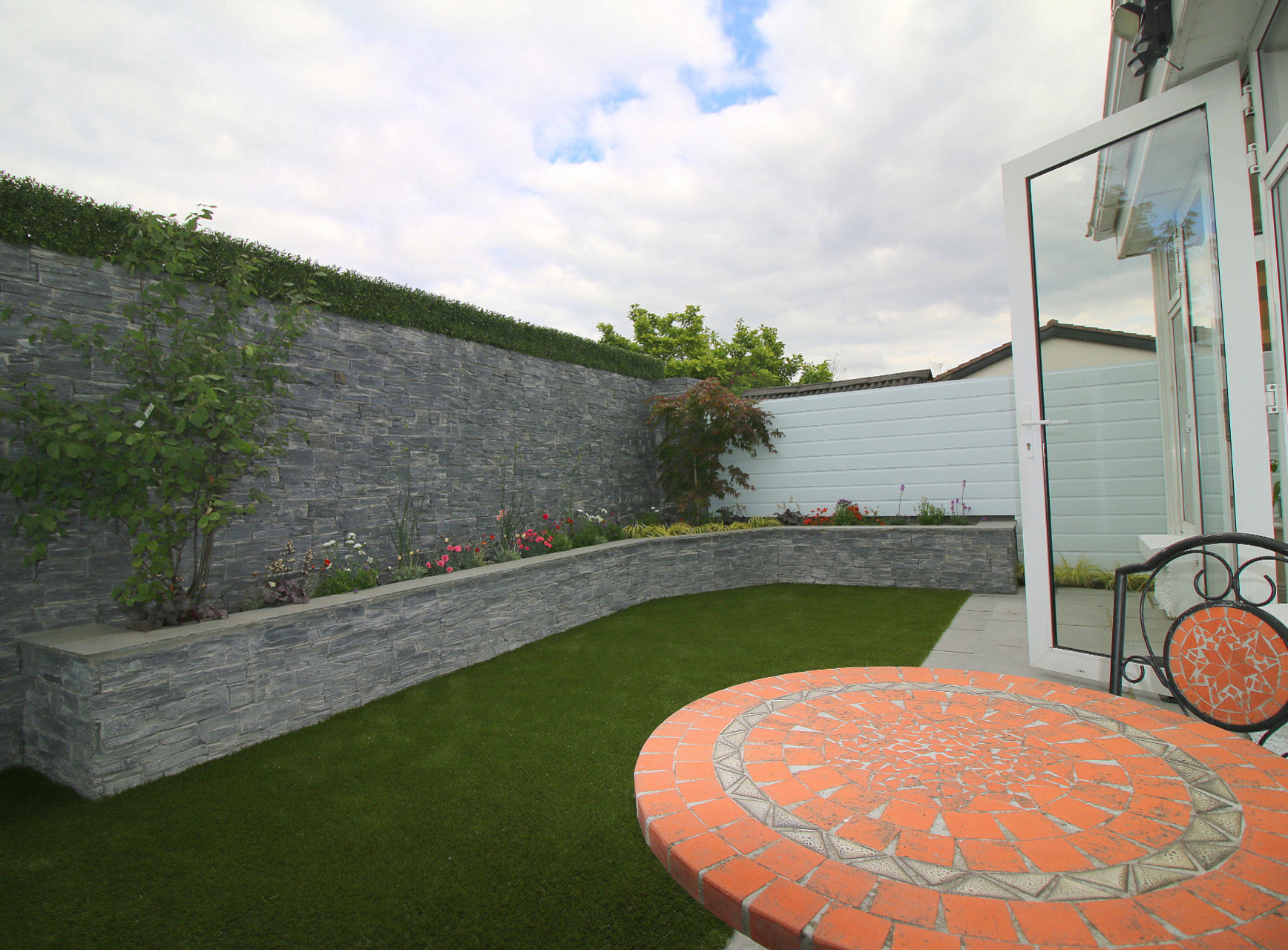 Natural Stone Cladding & Boxwood Cladding to create a feature wall in Terenure Garden | Owen Chubb