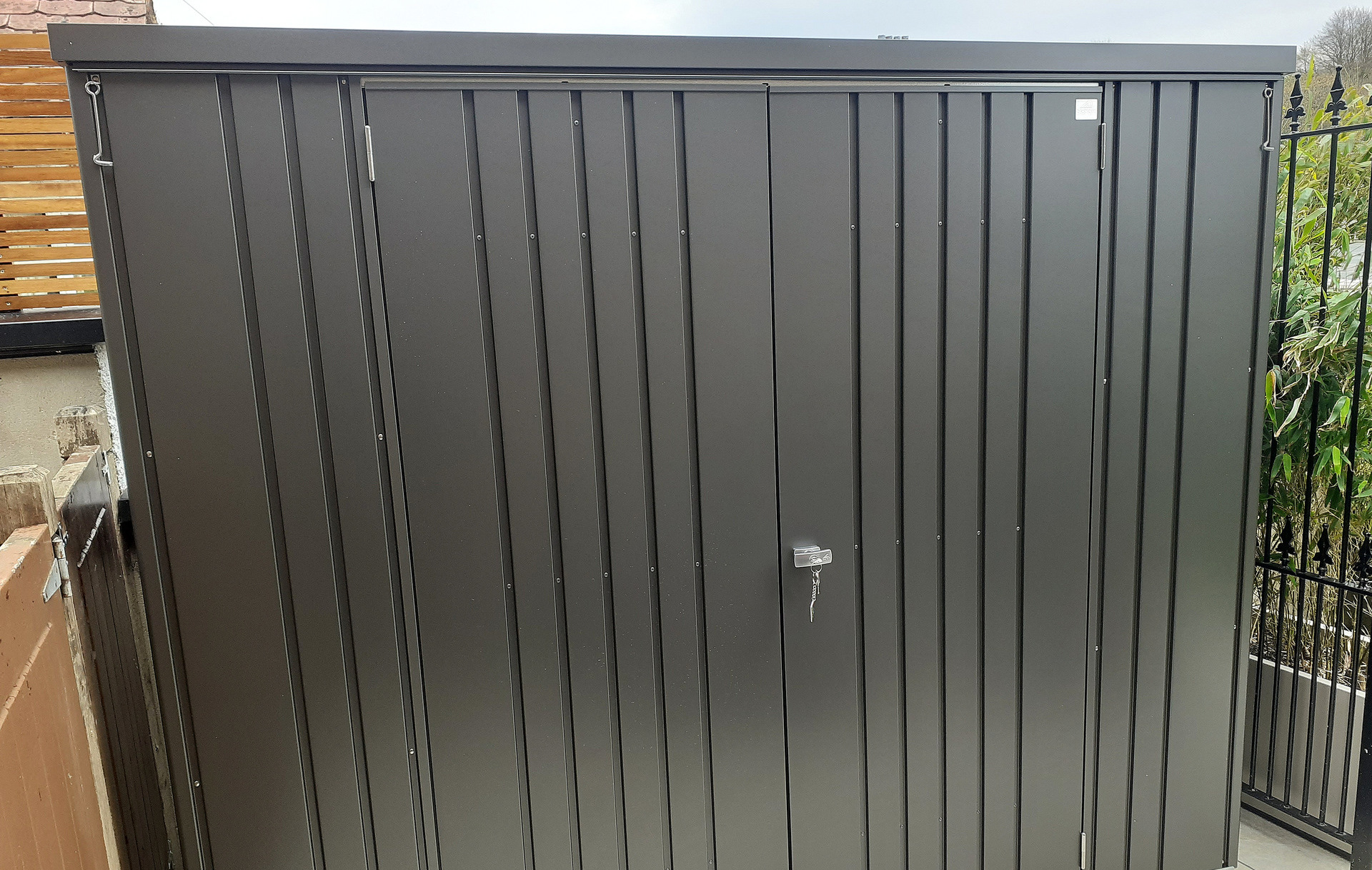 The superb quality and style of the Biohort Equipment Locker 230 in metallic dark grey  | supplied + installed in Belfast, Northern Ireland by Owen Chubb Landscapers. Authorised Biohort Dealer and Biohort Certified Installation Partner. Tel 087-2306 128.