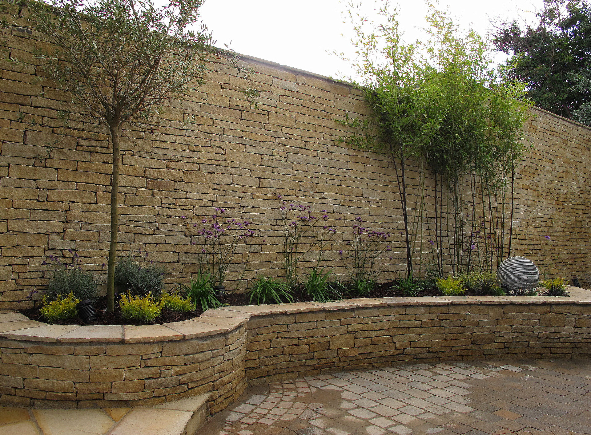 Make a wall a feature - natural stone garden wall | Owen Chubb Garden Landscapers
