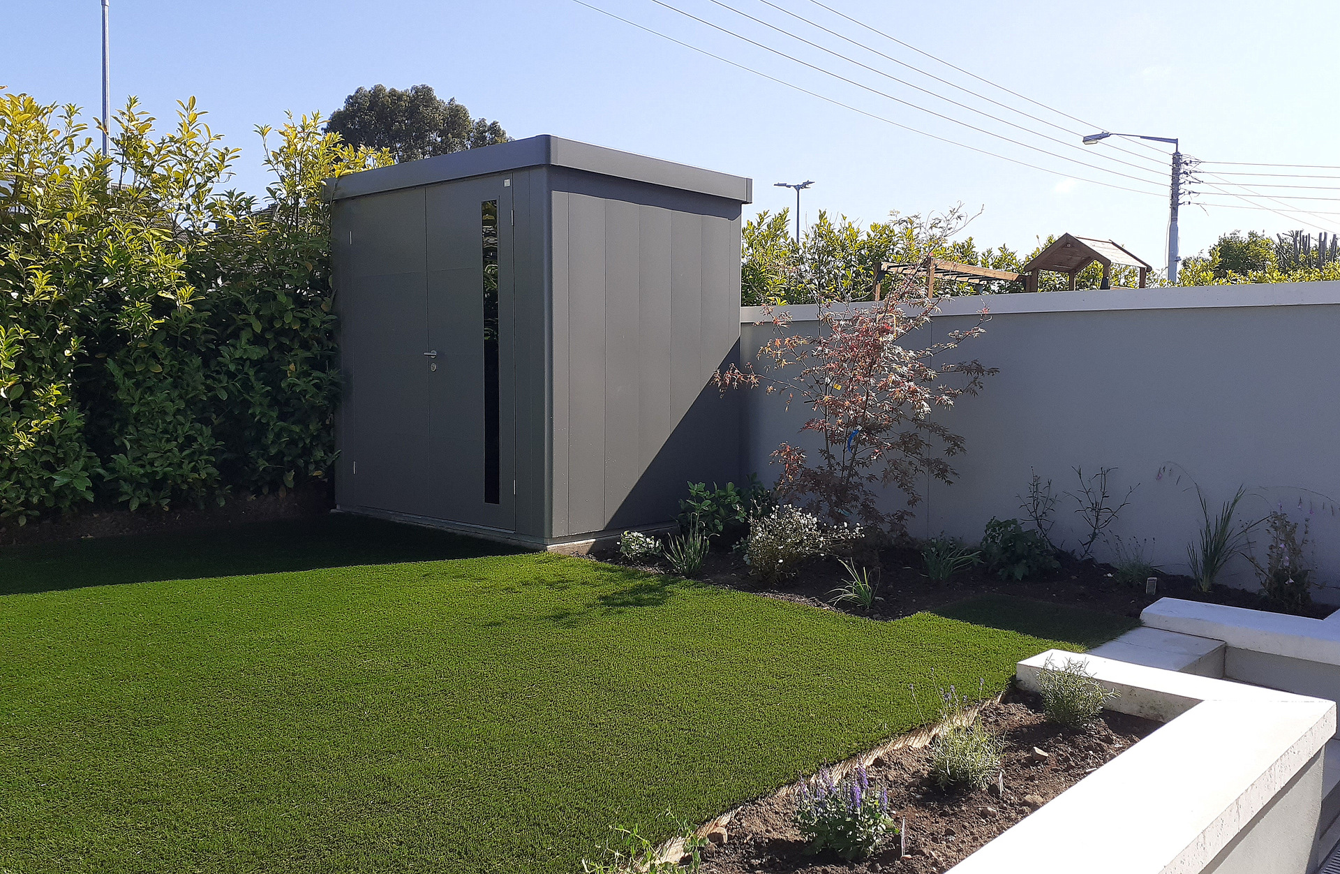 Biohort Neo Garden Shed, Size 1B in metallic quartz grey - supplied + fitted in Killiney, Co Dublin by Owen Chubb Landscapers, Ireland's Premier Biohort Supplier and Trained & Certified Installation Partner.