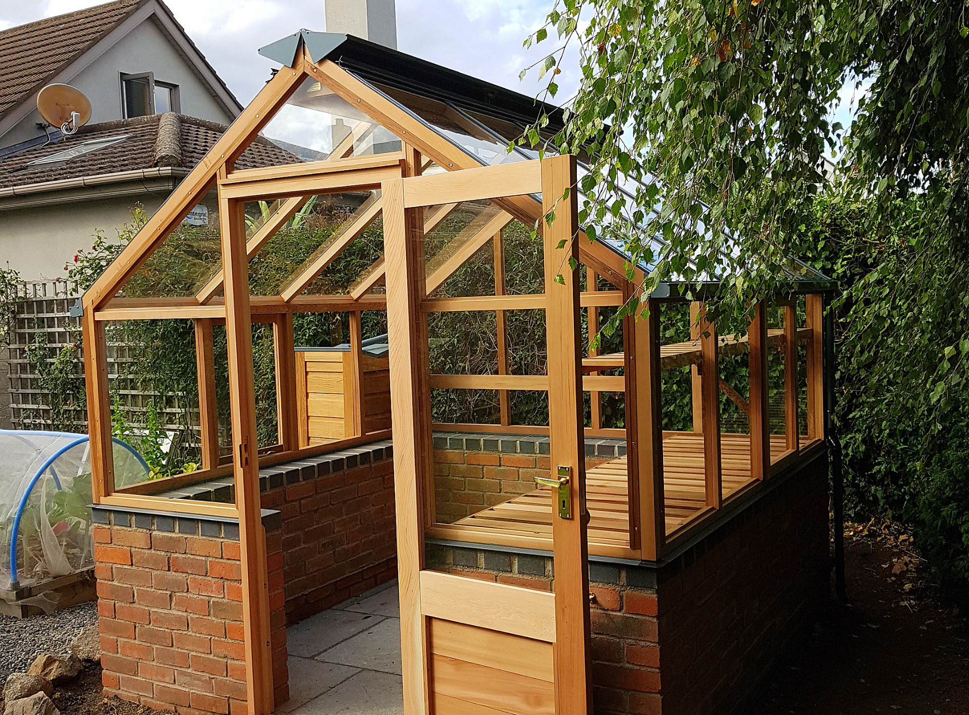 Gabriel Ash Classic Eight (8x8) Greenhouse on brick wall in Sandyford, Dublin 18. | the only timber greenhouses endorsed by the RHS | Owen Chubb  087-2306128